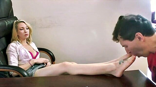 Blonde Linda indulges in office foot fetish play in BDSMX.Tube\'s exclusive sex.videos, showcasing her pink feet being adored.