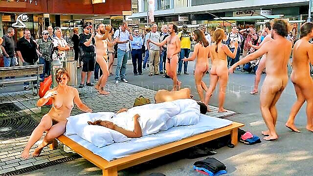 In this explicit video preview, a stunning woman engages in public nudity and erotic poses in the heart of Biel, Canton Bern.