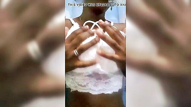 In this amateur video, a sexy Cuban woman enjoys a sensual massage that leads to her ebony nipples hardening.