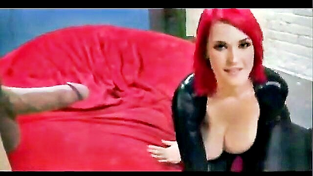 Fiery-haired Siri in seductive latex indulges in intense, passionate lovemaking, showcasing her ample bosom.