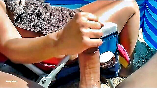 sexy milfs public beach handjob leads to a massive cumshot : Milf