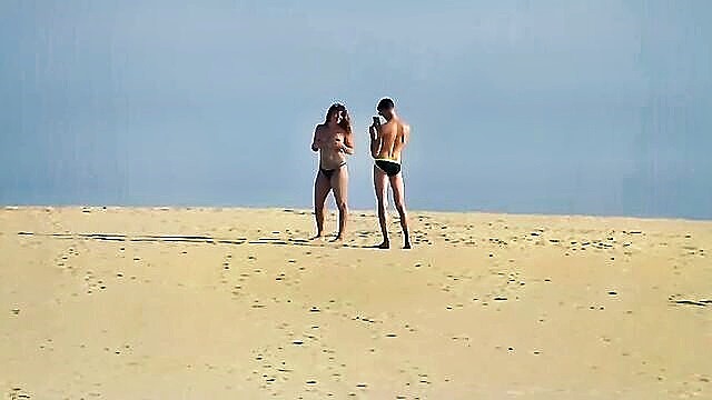 energetic exhibitionist flaunts his excitement in the dunes : Ts