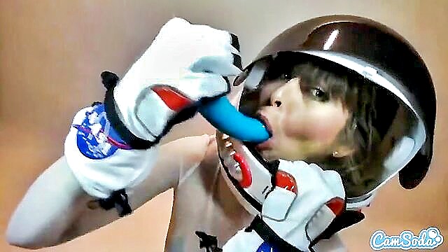 Riley Reid in a seductive astronaut booty suit, teasing with a dildo, delivering ultimate pleasure on CamSoda at porn.com.