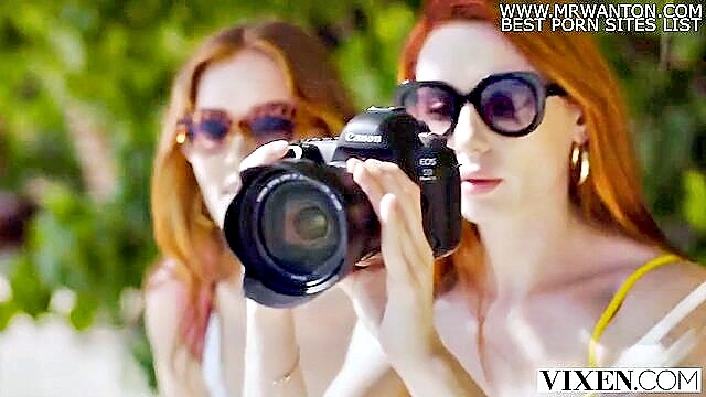 A stunning redhead gets seduced by a well-endowed bartender on vacation, leading to a steamy threesome with explicit HD content.