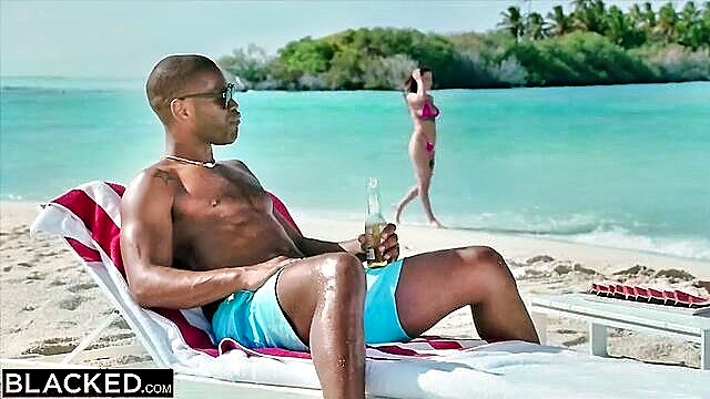 a small white lady is engaging in sexual activity with a black gentleman on the coastline : Blacked