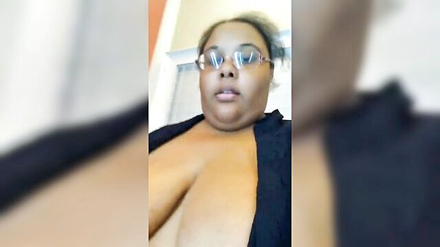 In this image, the ebony SSBBW Jessica Jones embarrasses herself in a dressing room, getting naughty by stripping down and pleasuring herself.