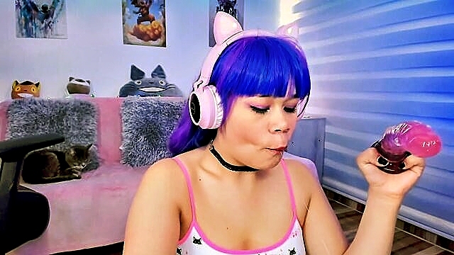 Lila Jordan indulges in a sensual blowjob, creating saliva-filled bubbles with her tongue, showcasing an Asian Ahegao aesthetic.